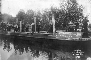 210. German POWs unloading timber at Frimley Wharf